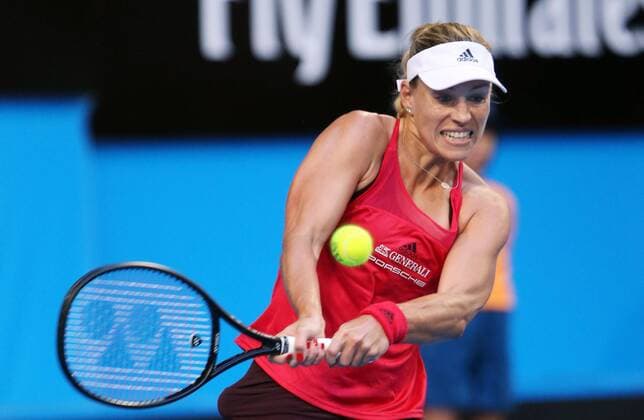 (180101) -- PERTH, Jan. 1, 2018 -- Angelique Kerber of Germany returns the ball to Elise Mertens of Belgium during a group match between Germany and Belgium at the Hopman Cup mixed teams tennis tournament in Perth, Australia, Jan. 1, 2018. ) (SP)AUSTRALIA-PERTH-TENNIS-HOPMAN CUP ZhouxDan 