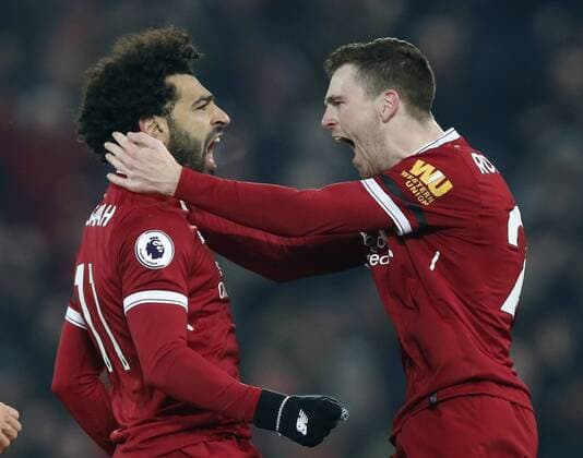 Bilder des Tages - SPORT Mohamed Salah of Liverpool (l) celebrates scoring the fourth goal during the premier league match at Anfield Stadium, Liverpool. Picture date 14th January 2018. Picture credit should read: Andrew Yates Sportimage EDITORIAL USE ONLY. No use with unauthorised audio, video, data, fixture lists, club league logos or live services. Online in-match use limited to 120 images, no video emulation. No use in betting, games or single club league player publications.