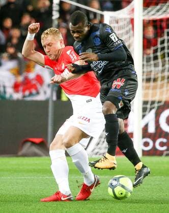 (180117) -- FONTVIEILLE, Jan. 17, 2018 -- Kamil Glik (L) of Monaco competes with Jean Machael Seri of Nice during the match between Monaco and Nice at the French Ligue 1 2017-2018 season 21st round in Fontvieille, Monaco on Jan. 16, 2018. Monaco tied Nice 2-2. ) (SP)MONACO-FONTVIEILLE-FOOTBALL-FRENCH LIGUE 1-MONACO VS NICE SergexHaouzi 