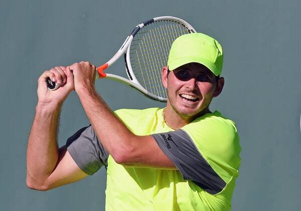 NEWPORT BEACH, CA - JANUARY 23: Dennis Novikov (USA) hits a backhand shot in the third set of a match against Kei Nishikori (JPN) during the Oracle Challenger Series tennis tournament played on January 23, 2018 at the Newport Beach Tennis Club in Newport Beach, CA. (Photo by John Cordes Icon Sportswire)