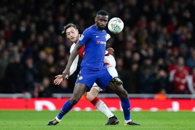 Antonio Rudiger of Chelsea and Mesut Ozil of Arsenal during the semi-final second leg of the Carabao Cup match at the Emirates Stadium,London. Picture date 24th January 2018. Picture credit should read: Charlie Forgham-Bailey Sportimage EDITORIAL USE ONLY. No use with unauthorised audio, video, data, fixture lists, club league logos or live services. Online in-match use limited to 120 images, no video emulation. No use in betting, games or single club league player publications.