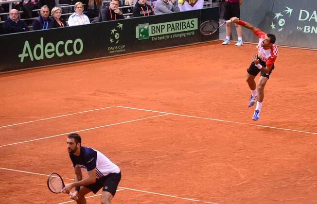 (180204) -- OSIJEK, Feb. 4, 2018 -- Marin Cilic and Ivan Dodig (R) of Croatia compete during the third match against Daniel Nestor and Vasek Pospisil of Canada at Davis Cup World Group first round match between Croatia and Canada in Osijek, Croatia, on Feb. 3, 2018. ) (SP)CROATIA-OSIJEK-TENNIS-DAVIS CUP-WORLD GROUP-1ST ROUND-DOUBLES MarkoxPrpic 