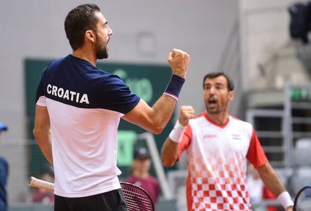 (180204) -- OSIJEK, Feb. 4, 2018 -- Marin Cilic (L) and Ivan Dodig of Croatia celebrate during the third match against Daniel Nestor and Vasek Pospisil of Canada at Davis Cup World Group first round match between Croatia and Canada in Osijek, Croatia, on Feb. 3, 2018. ) (SP)CROATIA-OSIJEK-TENNIS-DAVIS CUP-WORLD GROUP-1ST ROUND-DOUBLES MarkoxPrpic 