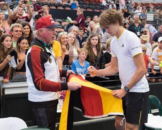 Boris Becker haelt eine deutsche Fahne die ALEXANDER ZVEREV unterschreibt, Davis Cup AUS_GER, Pat Rafter Arena, Brisbane Tennis - Davis Cup 2018 - ITF Davis Cup - Pat Rafter Arena - Brisbane - - Australia - 4 February 2018. Â Copyright: xJuergenxHasenkopfx