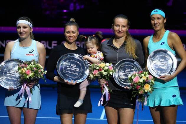 ST PETERSBURG, RUSSIA â€“ FEBRUARY 4, 2018: Timea Bacsinszky of Switzerland, Vera Zvonareva of Russia and Alla Kudryavsteva of Russia and Katarina Srebotnik of Slovenia hold trophies at an awards ceremony following their doubles final match at the 2018 St Petersburg Ladies Trophy tennis tournament. Bacsinszky and Zvonareva won the match 2-6, 6-1, 10-3. Peter Kovalev TASS  TS07233F