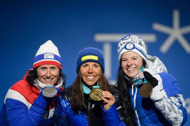 180210 Silver medalist Marit Bj¿rgen of Norway, gold medalist Charlotte Kalla of Sweden and bronze medalist Krista Pärmäkoski of Finland at the medal ceremony for the Women s Skiathlon during the 2018 Winter Olympics on February 10, 2018 in Pyeongchang. Photo: Jon Olav Nesvold BILDBYRN kod JE 160152ö Copyright: JONxOLAVxNESVOLD BB180210BB239