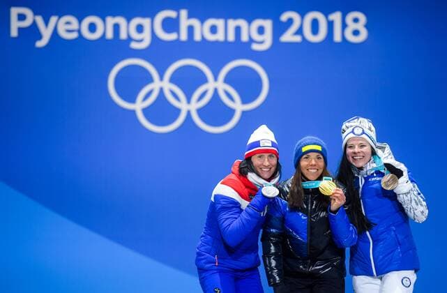 180210 Silver medalist Marit Bj¿rgen of Norway, gold medalist Charlotte Kalla of Sweden and bronze medalist Krista Pärmäkoski of Finland at the medal ceremony for the Women s Skiathlon during the 2018 Winter Olympics on February 10, 2018 in Pyeongchang. Photo: Jon Olav Nesvold BILDBYRN kod JE 160152ö Copyright: JONxOLAVxNESVOLD BB180210BB244