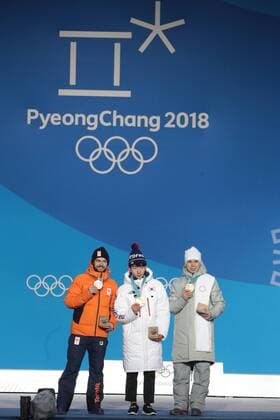 PYEONGCHANG, SOUTH KOREA â€“ FEBRUARY 11, 2018: Silver medallist Sjinkie Knegt of the Netherlands, Gold medallist Lim Hyo-jun of South Korea, and bronze medallist Semyon Yelistratov, Olympic Athlete from Russia, from left, pose at the victory ceremony for the for men s 1500m short track Speed skating Eisschnelllauf event at the 2018 Winter Olympic Games Olympische Spiele Olympia OS at Medals Plaza. Sergei Bobylev TASS  TS0734B2