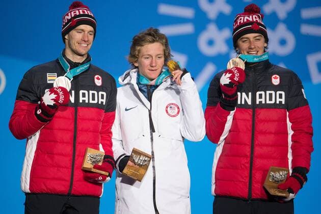 From left menÕs snowboard slopestyle silver medalist Max Parrot of Canada, gold medalist Redmond Gerard of the United States and bronze medalist Mark McMorris of Canada celebrate on the podium during a medal ceremony for the Pyeongchang 2018 Winter Olympics, at the Olympic Medal Plaza in Daegwalnyeong, South Korea, on February 11, 2018.  OLY20180211148 MATTHEWxHEALEY