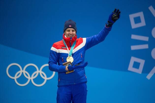 Men s cross-country skiing 15km + 15km skiathalon gold medalist Simen Heisted Krueger of Norway waves to the crowd while on the podium during a medal ceremony for the Pyeongchang 2018 Winter Olympics, at the Olympic Medal Plaza in Daegwalnyeong, South Korea, on February 11, 2018.  OLY20180211150 MATTHEWxHEALEY