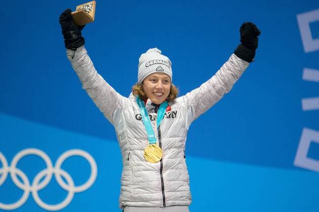 Women s 7.5m sprint biathlon gold medalist Laura Dahlmeier of Germany (C) celebrates on the podium during a medal ceremony for the Pyeongchang 2018 Winter Olympics, at the Olympic Medal Plaza in Daegwalnyeong, South Korea, on February 11, 2018.  OLY20180211138 MATTHEWxHEALEY