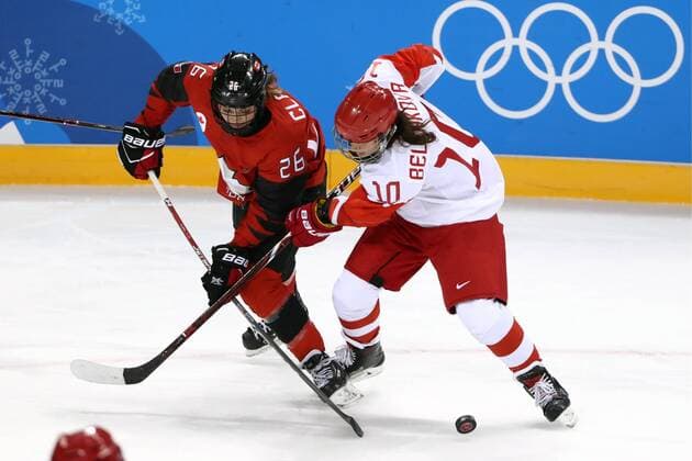GANGNEUNG, SOUTH KOREA - FEBRUARY 11, 2018: Canada s Emily Clark (L) and Olympic Athlete from Russia Lyudmila Belyakova in action in their women s preliminary round Group A Ice hockey Eishockey match at the 2018 Winter Olympic Games Olympische Spiele Olympia OS at Kwandong Hockey Centre. Valery Sharifulin TASS  TS073515