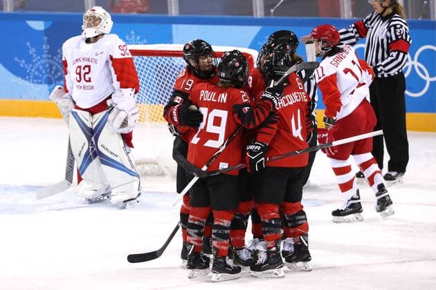 GANGNEUNG, SOUTH KOREA - FEBRUARY 11, 2018: Olympic Athlete from Russia, goalie Nadezhda Morozova (L) looks on as Canada s players celebrate scoring in their women s preliminary round Group A Ice hockey Eishockey match at the 2018 Winter Olympic Games Olympische Spiele Olympia OS at Kwandong Hockey Centre. Team Canada won the game 5-0. Valery Sharifulin TASS  TS073520