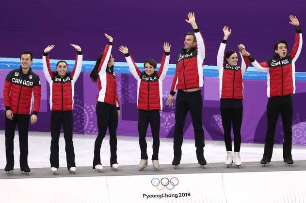 GANGNEUNG, SOUTH KOREA â€“ FEBRUARY 12, 2018: Gold medallists Patrick Chan, Gabrielle Daleman, Kaetlyn Osmond, Meagan Duhamel, Eric Radford, Tessa Virtue, and Scott Moir (L-R) of Canada pose at a flower ceremony for the Figure skating Eiskunstlauf team event at the 2018 Winter Olympic Games Olympische Spiele Olympia OS at the Gangneung Ice Arena. Valery Sharifulin TASS  TS0736AC