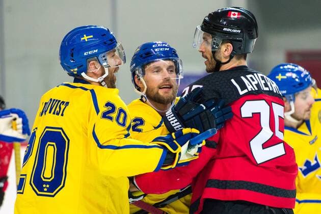 180212 Joel Lundqvist and Fredrik Pettersson of Sweden i a fight with Maxim Lapierre of Canada during the Men s Ice hockey Eishockey International Friendly Länderspiel match between Sweden and Canada during day three of the 2018 Winter Olympics on February 12, 2018 in Incheon. Photo: Petter Arvidson BILDBYRN kod PA 91961 Copyright: PETTERxARVIDSON BB180212PA072