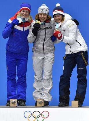 L-R Norwegian biathlete Marte Olsbu (silver medal), German biathlete Laura Dahlmeier (gold medal) and Czech biathlete Veronika Vitkova (bronze medal) are seen during the medal ceremony of biathlon, 7,5 KM, women, within the 2018 Winter Olympics in Pyeongchang, South Korea, February 11, 2018. (CTKxPhoto MichalxKamaryt) CTKPhotoP201802110415501  kmt 8