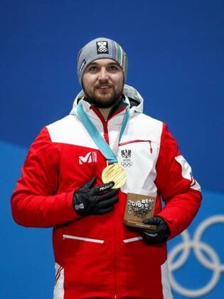 OLYMPICS - 2018 Winter Olympics PYEONGCHANG,SOUTH KOREA,12.FEB.18 - OLYMPICS, LUGE - Olympic Winter games Winterspiele Spiele Summer games PyeongChang 2018, Medals Plaza, men, award ceremony. Image shows David Gleirscher (AUT). Keywords: medal. GEPAxpictures xMaticxKlansek