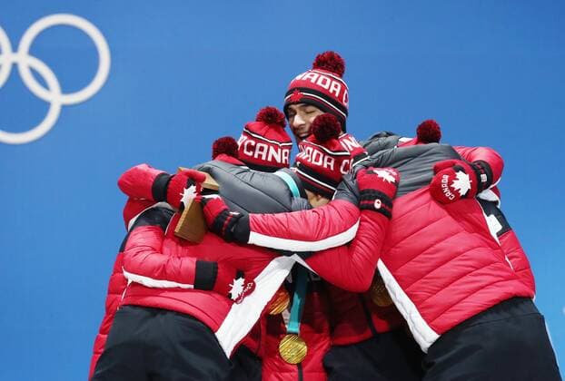 PYEONGCHANG, SOUTH KOREA â€“ FEBRUARY 12, 2018: Figure skaters of Canada pose with their gold medals at the victory ceremony for the Figure skating Eiskunstlauf team event at the 2018 Winter Olympic Games Olympische Spiele Olympia OS Valery Sharifulin TASS  TS0737CB
