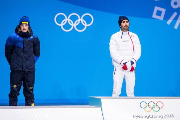 180213 Sebastian Samuelsson of Sweden, silver, and Martin Fourcade of France, Gold, at the medal ceremony for the Men s Biathlon 12,5 km Pursuit during day four of the 2018 Winter Olympics on February 13, 2018 in Pyeongchang. Photo: Jon Olav Nesvold BILDBYRAN kod JE 160160 Copyright: JONxOLAVxNESVOLD BB180213JE078