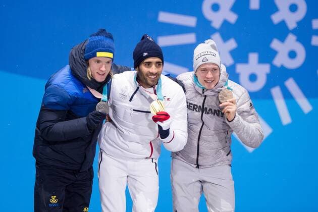 180213 Sebastian Samuelsson of Sweden, silver, Martin Fourcade of France, Gold, and Benedikt Doll of Germany, Bronze, celebrates at the medal ceremony for the Men s Biathlon 12,5 km Pursuit during day four of the 2018 Winter Olympics on February 13, 2018 in Pyeongchang. Photo: Jon Olav Nesvold BILDBYRAN kod JE 160160 Copyright: JONxOLAVxNESVOLD BB180213JE089