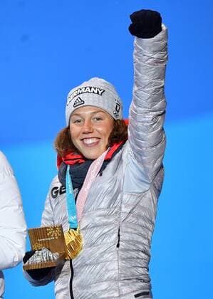 Gold medalist Germany s Laura Dahlmeier celebrates during the medal ceremony for Biathlon Women s 10km Pursuit at the medal s plaza during the Pyeongchang 2018 Winter Olympics in Pyeongchang, South Korea, on February 13, 2018.  OLY20180213373 KEVINxDIETSCH