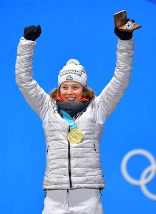 Gold medalist Germany s Laura Dahlmeier celebrates during the medal ceremony for Biathlon Women s 10km Pursuit at the medal s plaza during the Pyeongchang 2018 Winter Olympics in Pyeongchang, South Korea, on February 13, 2018.  OLY20180213374 KEVINxDIETSCH
