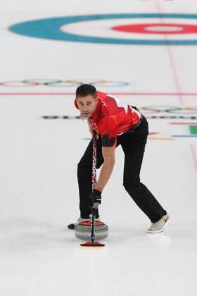 John Morris of Canada sweeps during the Gold Medal Mixed Doubles game against Switzerland at the Gangneung Curling Center in Gangneung, South Korea during the 2018 Pyeongchang Winter Olympics on February 13, 2018. Canada won 10-3.  OLY20180213819 ANDREWxWONG