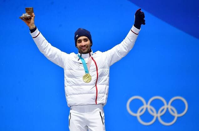 Gold medalist France s Martin Fourcade celebrates during the medal ceremony for Biathlon Men s 12.5km Pursuit at the medal s plaza during the Pyeongchang 2018 Winter Olympics in Pyeongchang, South Korea, on February 13, 2018.  OLY20180213367 KEVINxDIETSCH