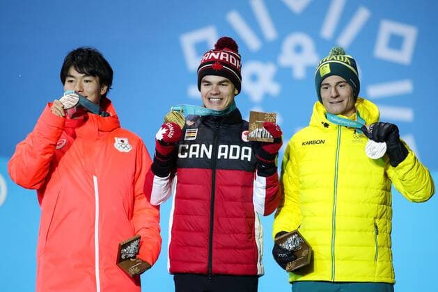 OLYMPICS - 2018 Winter Olympics PYEONGCHANG,SOUTH KOREA,13.FEB.18 - OLYMPICS, FREE SKI, FREESTYLE SKIING - Olympic Winter games Winterspiele Spiele Summer games PyeongChang 2018, Medals Plaza, Moguls, Men, award ceremony. Image shows Matt Graham (AUS), Mikael Kingsbury (CAN) and Daichi Hara (JPN). Keywords: medals. GEPAxpictures xMaticxKlansek