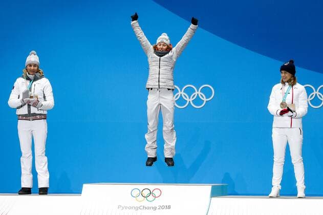 OLYMPICS - 2018 Winter Olympics PYEONGCHANG,SOUTH KOREA.13.FEB.18 - OLYMPICS,BIATHLON - Olympic Winter games Winterspiele Spiele Summer games PyeongChang 2018, Medals Plaza, 10km Pursuit, ladies, award ceremony. Image shows Anastasiya Kuzmina (SVK), the rejoicing of Laura Dahlmeier (GER) and Anais Bescond (FRA). Keywords: medals. GEPAxpictures xMaticxKlansek