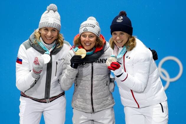 OLYMPICS - 2018 Winter Olympics PYEONGCHANG,SOUTH KOREA.13.FEB.18 - OLYMPICS,BIATHLON - Olympic Winter games Winterspiele Spiele Summer games PyeongChang 2018, Medals Plaza, 10km Pursuit, ladies, award ceremony. Image shows Anastasiya Kuzmina (SVK), Laura Dahlmeier (GER) and Anais Bescond (FRA). Keywords: medals. GEPAxpictures xMaticxKlansek