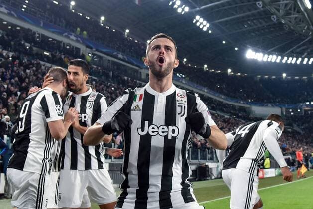 February 13, 2018 - Turin, Italy - Miralem Pjanic of Juventus celebrates after Gonzalo Higuain of Juventus scored first goal during the UEFA Champions League Round of 16 match between Juventus and Tottenham Hotspur at the Juventus Stadium, Turin, Italy on 13 February 2018. Juventus v Tottenham - UEFA Champions League  - ZUMAn230 20180213_zaa_n230_563 Copyright: xGiuseppexMaffiax