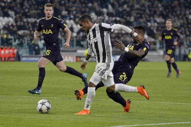 13th February 2018, Allianz Stadium, Turin, Italy; UEFA Champions League football, round of 16, first leg, Juventus versus Tottenham Hotspur; Serge Aurier fouls Douglas Costa in the penaly area and the referee gives the second penalty for Juventus  ActionPlus11986663