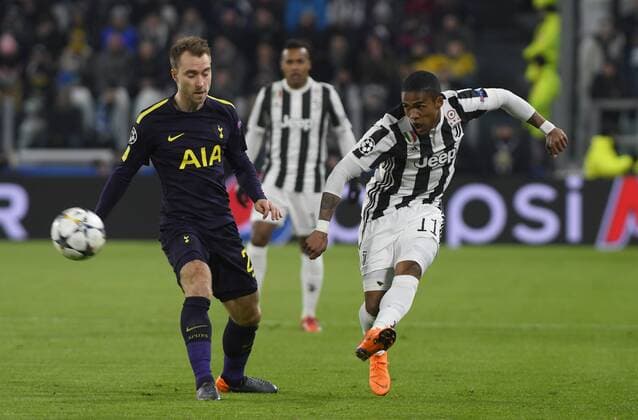 13th February 2018, Allianz Stadium, Turin, Italy; UEFA Champions League football, round of 16, first leg, Juventus versus Tottenham Hotspur; Douglas Costa crosses the ball in the box while Christian Eriksen defends  ActionPlus11986665