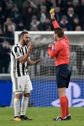 February 13, 2018 - Turin, Italy - Gonzalo Higuain of Juventus gets a yellow card from the referee during the UEFA Champions League Round of 16 match between Juventus and Tottenham Hotspur at the Juventus Stadium, Turin, Italy on 13 February 2018. Juventus v Tottenham - UEFA Champions League  - ZUMAn230 20180213_zaa_n230_592 Copyright: xGiuseppexMaffiax