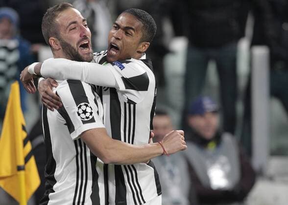 February 13, 2018 - Turin, Italy - Gonzalo Higuain and Douglas Costa during the UEFA Champions League round of sixteen first leg football match between Juventus and Tottenham Hotspur at The Allianz Stadium in Turin on February 13, 2018. Juventus v Tottenham Hotspur - UEFA Champions League Round of 16: First Leg  - ZUMAn230 20180213_zaa_n230_617 Copyright: xLorisxRosellix