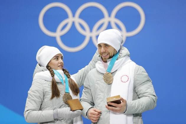 PYEONGCHANG, SOUTH KOREA - FEBRUARY 14, 2018: Bronze medalists, Olympic Athletes from Russia Anastasia Bryzgalova (L) and Aleksandr Krushelnitckii during a medal ceremony for the curling mixed doubles competition at the 2018 Winter Olympic Games Olympische Spiele Olympia OS at Medals Plaza. Sergei Bobylev TASS  TS073BF1