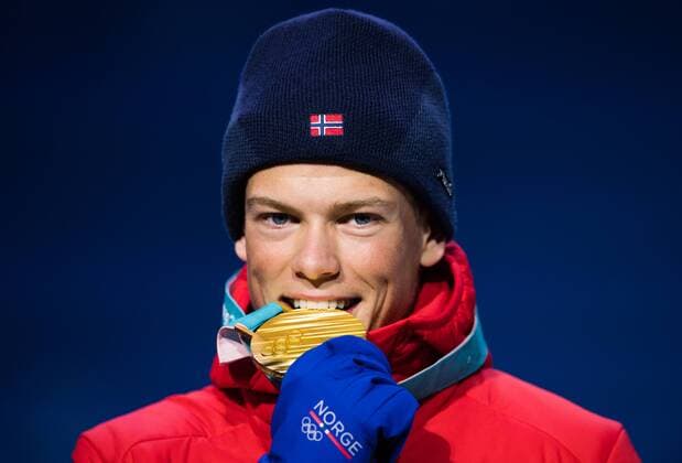180214 Johannes Hosflot Klaebo of Norway, Gold, celebrates at the medal ceremony for the Men s Cross Country Sprint during day five of the 2018 Winter Olympics on February 14, 2018 in Pyeongchang. Photo: Carl Sandin BILDBYRAN kod CS 57999_292 Copyright: CARLxSANDIN BB180214CS095