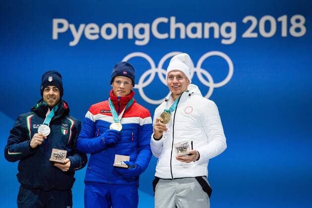 180214 Federico Pellegrino of Italy, silver, Johannes Hosflot Klaebo of Norway, Gold, and Alexander Bolshunov of OAR (Russia), celebrates at the medal ceremony for the Men s Cross Country Sprint during day five of the 2018 Winter Olympics on February 14, 2018 in Pyeongchang. Photo: Carl Sandin BILDBYRAN kod CS 57999_292 Copyright: CARLxSANDIN BB180214CS102