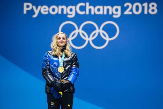 180214 Stina Nilsson of Sweden, Gold, celebrates at the medal ceremony for the Men s Cross Country Sprint during day five of the 2018 Winter Olympics on February 14, 2018 in Pyeongchang. Photo: Carl Sandin BILDBYRAN kod CS 57999_292 Copyright: CARLxSANDIN BB180214CS104