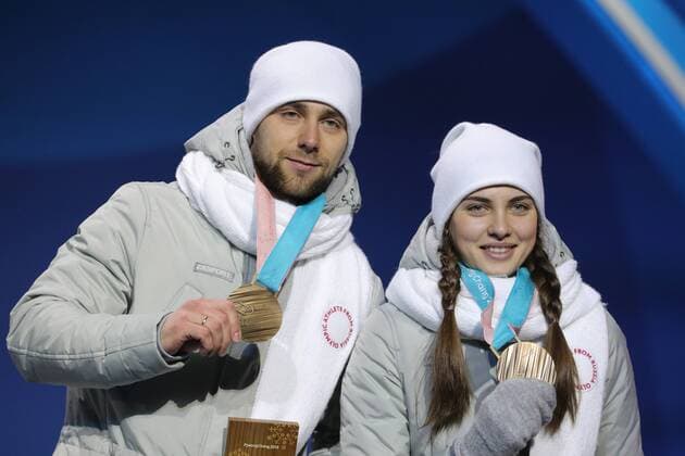 PYEONGCHANG, SOUTH KOREA - FEBRUARY 14, 2018: Bronze medalists, Olympic Athletes from Russia Anastasia Bryzgalova (R) and Aleksandr Krushelnitckii during a medal ceremony for the curling mixed doubles competition at the 2018 Winter Olympic Games Olympische Spiele Olympia OS at Medals Plaza. Sergei Bobylev TASS  TS073C08