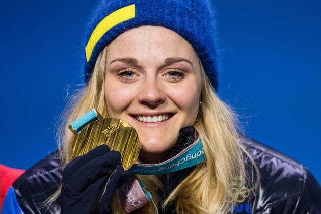 180214 Stina Nilsson of Sweden, Gold, celebrating at the medal ceremony for the Women s Cross Country Sprint during day five of the 2018 Winter Olympics on February 14, 2018 in Pyeongchang. Photo: Carl Sandin BILDBYRN kod CS 57999_292 Copyright: CARLxSANDIN BB180214CS115