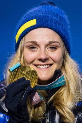 180214 Stina Nilsson of Sweden, Gold, celebrating at the medal ceremony for the Women s Cross Country Sprint during day five of the 2018 Winter Olympics on February 14, 2018 in Pyeongchang. Photo: Carl Sandin BILDBYRN kod CS 57999_292 Copyright: CARLxSANDIN BB180214CS116