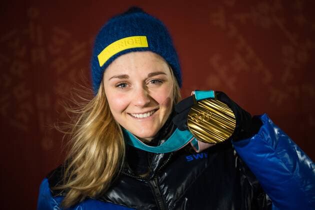 180214 Stina Nilsson of Sweden, Gold, celebrating at the medal ceremony for the Women s Cross Country Sprint during day five of the 2018 Winter Olympics on February 14, 2018 in Pyeongchang. Photo: Carl Sandin BILDBYRN kod CS 57999_292 Copyright: CARLxSANDIN BB180214CS117