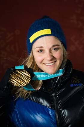 180214 Stina Nilsson of Sweden, Gold, celebrating at the medal ceremony for the Women s Cross Country Sprint during day five of the 2018 Winter Olympics on February 14, 2018 in Pyeongchang. Photo: Carl Sandin BILDBYRAN kod CS 57999_292 Copyright: CARLxSANDIN BB180214CS118