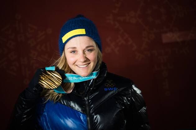 180214 Stina Nilsson of Sweden, Gold, celebrating at the medal ceremony for the Women s Cross Country Sprint during day five of the 2018 Winter Olympics on February 14, 2018 in Pyeongchang. Photo: Carl Sandin BILDBYRAN kod CS 57999_292 Copyright: CARLxSANDIN BB180214CS119