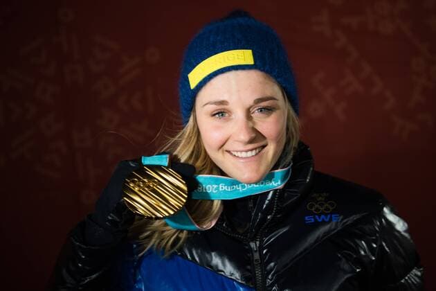 180214 Stina Nilsson of Sweden, Gold, celebrating at the medal ceremony for the Women s Cross Country Sprint during day five of the 2018 Winter Olympics on February 14, 2018 in Pyeongchang. Photo: Carl Sandin BILDBYRAN kod CS 57999_292 Copyright: CARLxSANDIN BB180214CS120