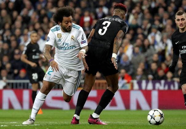 Real Madrid s Marcelo Vieira (L) vies for the ball with Paris Saint Germain s Presnel Kimpembe during the UEFA Champions League round of 16 first leg match between Real Madrid and Paris Saint Germain at the Santiago Bernabeu stadium in Madrid, Spain, 14 February 2018. Real Madrid vs. Paris Saint Germain !ACHTUNG: NUR REDAKTIONELLE NUTZUNG!  Copyright: xKikoxHuescax MAD007 20180214-636542400927366446