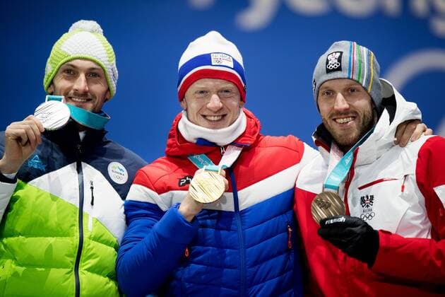 180216 Jakov Fak of Slovenia, (silver) Johannes Thingnes B¿ of Norway (gold) and Dominik LANDERTINGER of Austria (bronze) celebrate at a Medal Ceremony for Men s Biathlon 20 km during day seven of the 2018 Winter Olympics on February 16, 2018 in Pyeongchang. Photo: Jon Olav Nesvold BILDBYRN kod JE 160172 Copyright: JONxOLAVxNESVOLD BB180216JE064