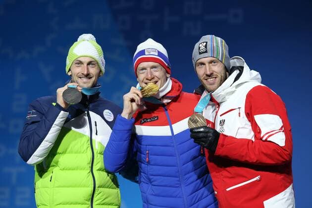 OLYMPICS - 2018 Winter Olympics PYEONGCHANG,SOUTH KOREA,16.FEB.18 - OLYMPICS,BIATHLON - Olympic Winter games Winterspiele Spiele Summer games PyeongChang 2018, Medals Plaza, 20km biathlon, men, award ceremony. Image shows Jakov Fak (SLO), Johannes Thingnes Boe (NOR) and Dominik Landertinger (AUT). keywords: medal. GEPAxpictures xMathiasxMandl